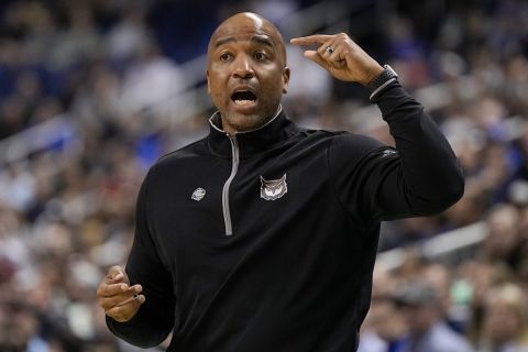 Kennesaw State head coach Amir Abdur-Rahim yells during the first half of a first-round college basketball game against Xavier in the NCAA Tournament on Friday, March 17, 2023, in Greensboro, N.C. (AP Photo/Chris Carlson)