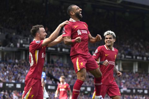 Liverpool's Mohamed Salah, center, celebrates after he scores his side's second goal during the English Premier League soccer match between Ipswich Town and Liverpool at Portman Road stadium in Ipswich, England, Saturday, Aug. 17, 2024. (AP Photo/Alastair Grant)