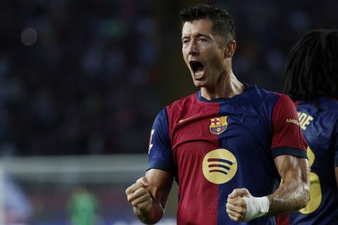 Barcelona's Robert Lewandowski celebrates after scoring his side's second goal during the Spanish La Liga soccer match between FC Barcelona and Athletic Bilbao at the Olympic stadium in Barcelona, Spain, Saturday, Aug. 24, 2024. (AP Photo/Joan Monfort)