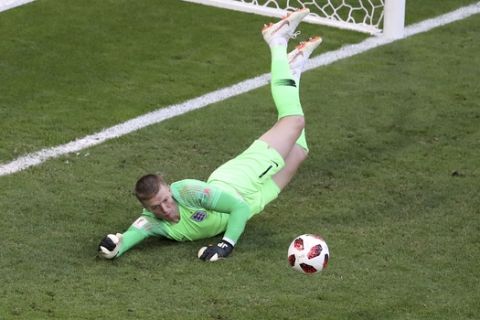 England goalkeeper Jordan Pickford dives for a save during the quarterfinal match between Sweden and England at the 2018 soccer World Cup in the Samara Arena, in Samara, Russia, Saturday, July 7, 2018. (AP Photo/Thanassis Stavrakis)