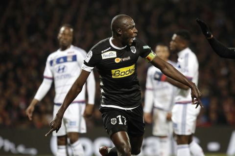 Angers' Cheikh Ndoye celebrates after he scored a goal against Lyon during their French League One soccer match at Gerland stadium, in Lyon, central France, Saturday, Dec. 5, 2015. (AP Photo/Laurent Cipriani)