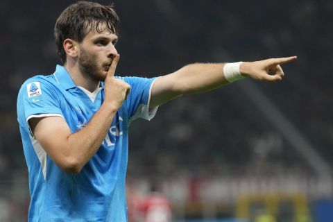 Napoli's Khvicha Kvaratskhelia celebrates after scoring his side's second goal during the Serie A soccer match between AC Milan and Napoli at the San Siro stadium, in Milan, Italy, Tuesday, Oct. 29, 2024. (AP Photo/Luca Bruno)