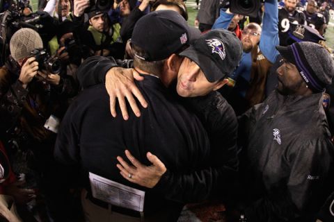 BALTIMORE, MD - NOVEMBER 24:  Head coach Jim Harbaugh of the San Francisco 49ers (L) hugs his brother head coach John Harbaugh of the Baltimore Ravens (R) after the Ravens defeated the 49ers 16-6 at M&T Bank Stadium on November 24, 2011 in Baltimore, Maryland.  (Photo by Rob Carr/Getty Images)