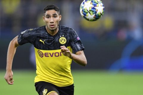 Dortmund's Achraf Hakimi goes for the ball during the Champions League Group F soccer match between Borussia Dortmund and FC Barcelona in Dortmund, Germany, Tuesday Sept. 17, 2019. (AP Photo/Martin Meissner)