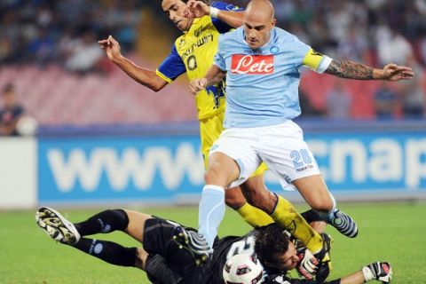 NAPLES, ITALY - SEPTEMBER 22:   Pablo Mariano Granoche of Chievo Verana is blocked by Paolo Cannavaro (R) and Morgan De Sanctis of Napoli during the Serie A match between Napoli and Chievo Verona at Stadio San Paolo on September 22, 2010 in Naples, Italy.  (Photo by Giuseppe Bellini/Getty Images)