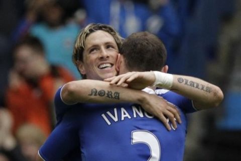 Chelsea's Fernando Torres, left, celebrates his goal with Branislav Ivanovic during the English FA Cup quarterfinal soccer match between Leicester City and Chelsea at Stamford Bridge stadium in London, Sunday, March 18, 2012.  (AP Photo/Matt Dunham)  