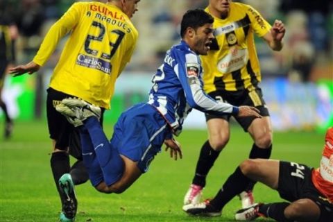 FC Porto's Givanildo 'Hulk' Souza, from Brazil, falls on the penalty box against Beira Mar in a Portuguese League soccer match at the Municipal stadium in Aveiro, Portugal, Saturday, Jan. 22, 2011. Hulk scored the opening goal from this penalty. (AP Photo/Paulo Duarte)