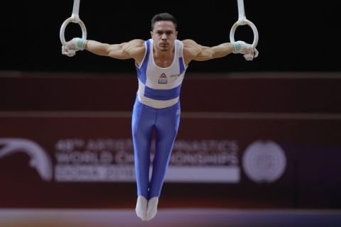 Gold medallist Greece's Eleftherios Petrounias performs on the rings on the first day of the apparatus finals of the Gymnastics World Championships at the Aspire Dome in Doha, Qatar, Friday, Nov. 2, 2018. (AP Photo/Vadim Ghirda)