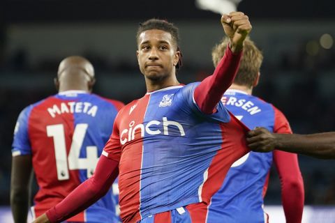 Crystal Palace's Michael Olise, centre, celebrates after scoring his side's second goal during the English Premier League soccer match between Manchester City and Crystal Palace at the Etihad Stadium in Manchester, England, Saturday, Dec.16, 2023. (AP Photo/Dave Thompson)