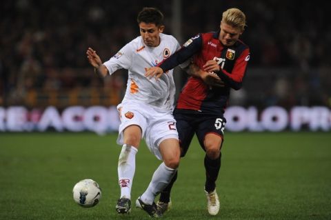 GENOA, ITALY - OCTOBER 26:  Alexander Merkel of Genoa CFC battles for the ball with Leandro Greco of AS Roma during the Serie A match between Genoa CFC and AS Roma at Stadio Luigi Ferraris on October 26, 2011 in Genoa, Italy.  (Photo by Valerio Pennicino/Getty Images)