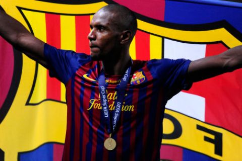 FC Barcelona's Eric Abidal reacts after winning the Super Cup trophy during the Super Cup final soccer match at the Louis II stadium in Monaco, Friday, Aug. 26, 2011. (AP Photo/Manu Fernandez)