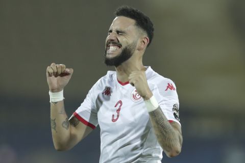 Tunisia's Dylan Bronn celebrates after the African Cup of Nations quarterfinal soccer match between Madagascar and Tunisia in Al Salam stadium in Cairo, Egypt, Thursday, July 11, 2019. (AP Photo/Hassan Ammar)