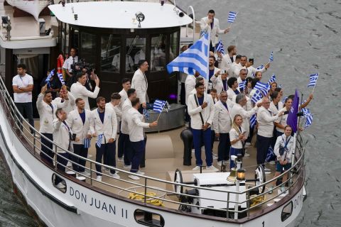 Team Greece travel by boat along the Seine River in Paris, France, during the opening ceremony of the 2024 Summer Olympics, Friday, July 26, 2024. (AP Photo/Matthias Schrader)