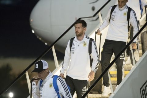 Lionel Messi, center, and his teammates disembark the plane as Argentina national soccer team arrive at Zhukovsky international airport outside Moscow, Russia, Saturday, June 9, 2018 to compete in the 2018 World Cup in Russia. The 21st World Cup begins on Thursday, June 14, 2018, when host Russia takes on Saudi Arabia. (AP Photo/Pavel Golovkin)