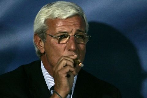 Italy's coach Marcello Lippi smokes a cigar prior to the 2006 Soccer World Cup qualifying match against Slovenia in Palermo, Sicily, Saturday, Oct. 8, 2005. (AP Photo/Alessandro Fucarini)