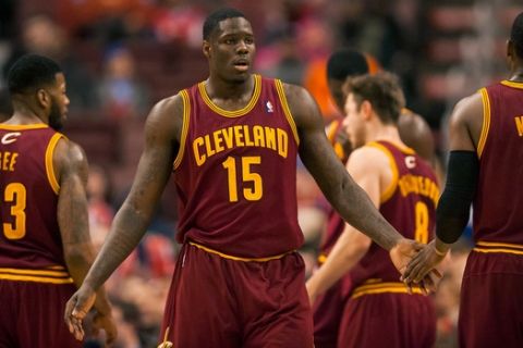 Feb 18, 2014; Philadelphia, PA, USA; Cleveland Cavaliers forward Anthony Bennett (15) celebrates with guard C.J. Miles (0) during the fourth quarter against the Philadelphia 76ers at the Wells Fargo Center. The Cavaliers defeated the Sixers 114-85. Mandatory Credit: Howard Smith-USA TODAY Sports