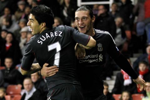 Liverpool's Uruguan player Luis Suarez (L)  celebrates scoring his second goal against Stoke City with Liverpool's Andy Carroll during a league cup fourth round football match at The Britannia Stadium in Stoke-on-Trent on October 26, 2011. AFP PHOTO/IAN KINGTON

RESTRICTED TO EDITORIAL USE. No use with unauthorised audio, video, data, fixture lists, club/league logos or âliveâ services. Online in-match use limited to 45 images, no video emulation. No use in betting, games or single club/league/player publications. (Photo credit should read IAN KINGTON/AFP/Getty Images)