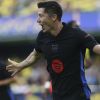 Barcelona's Robert Lewandowski celebrates after scoring the opening goal against Villarreal during a Spanish La Liga soccer match at the La Cerámica stadium in Villarreal, Spain, Sunday, Sept. 22, 2024. (AP Photo/Alberto Saiz)