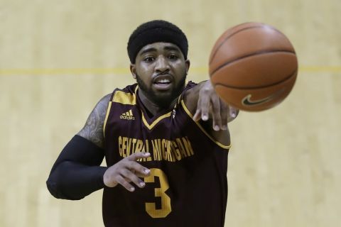 In a photo from Friday, Feb. 24, 2017, in Toledo, Ohio, Central Michigan University guard Marcus Keene passes the ball during an NCAA college basketball game against Toledo. (AP Photo/Carlos Osorio)