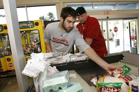 HOUSTON - OCTOBER 20:  Houston Rockets player Vassilis Spanoulis sacks groceries at a local HEB grocery store on October 20, 2006 in Houston, Texas. NOTE TO USER:User expressly acknowleges and agrees that, by downloading and/or using this Photograph, user is consenting to the terms and conditions of the Getty Images License Agreement. (Photo by Bill Baptist/NBAE via Getty Images) *** Local Caption *** Vassilis Spanoulis