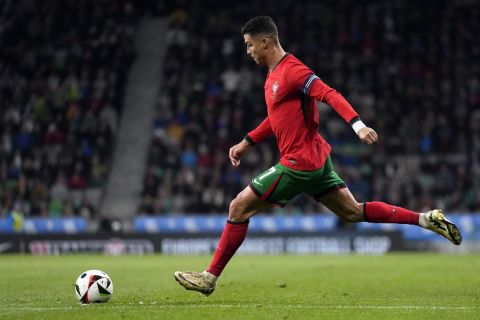 Portugal's Cristiano Ronaldo takes a free kick during the international friendly soccer match between Slovenia and Portugal at the Stozice stadium in Ljubljana, Slovenia, Tuesday, March 26, 2024. (AP Photo/Darko Bandic)