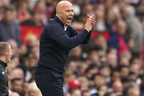 Liverpool's manager Arne Slot reacts during the English Premier League soccer match between Manchester United and Liverpool at Old Trafford, Sunday, Sept. 1, 2024, in Manchester, England. (AP Photo/Dave Thompson)