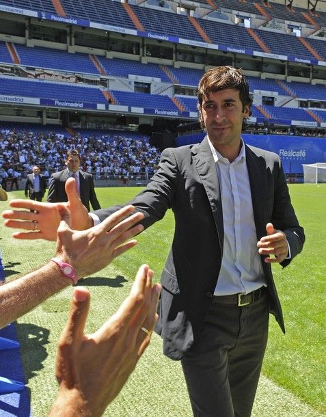 Former Real Madrid's captain Raul Gonzalez shakes hands with supporters before giving a press conference to announce his departure from the team at Santiago Bernabeu Stadium on July 26, 2010 in Madrid. Raul will join German side Schalke on a two-year contract. AFP PHOTO/Pedro ARMESTRE (Photo credit should read PEDRO ARMESTRE/AFP/Getty Images)