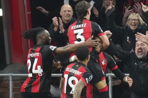 Bournemouth's Evanilson is mobbed by teammates after scoring his sides second goal during the English Premier League soccer match between Bournemouth and Manchester City at the Vitality stadium in Bournemouth, England, Saturday, Nov. 2, 2024. (AP Photo/Kirsty Wigglesworth)