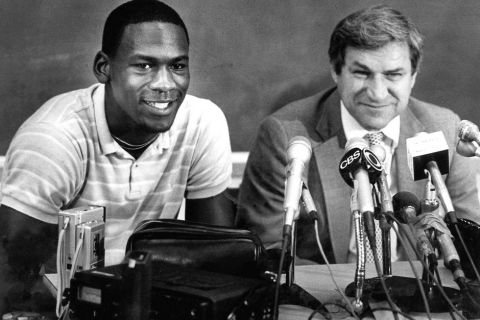 FILE - in this May 5, 1984 file photo, North Carolina guard Michael Jordan, left, and Tar Heels coach Dean Smith are shown at a news conference in Chapel Hill, N.C., where Jordan announced he would forfeit his final year of college eligibility to turn pro. Smith, the North Carolina basketball coaching great who won two national championships, died "peacefully" at his home Saturday night, Feb. 7, 2015, the school said in a statement Sunday from Smith's family. He was 83. (AP Photo, File)