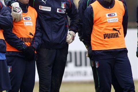 Italy national soccer team players from left, Antonio Cassano, goalie Gianluigi Buffon and Giampaolo Pazzini listen to coach Cesare Prandelli, not pictured, during a training session at Coverciano training grounds, near Florence, Italy, Tuesday, Feb. 8, 2011. Italy will play Germany in a friendly soccer match in Dortmund, Germany, on Wednesday. (AP Photo/Fabrizio Giovannozzi)