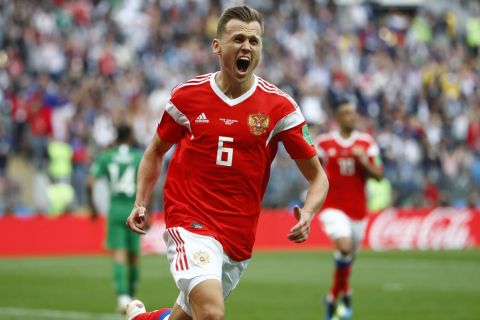 Russia's Denis Cheryshev celebrates after scoring his side's second goal during the group A match between Russia and Saudi Arabia which opens the 2018 soccer World Cup at the Luzhniki stadium in Moscow, Russia, Thursday, June 14, 2018. (AP Photo/Matthias Schrader)