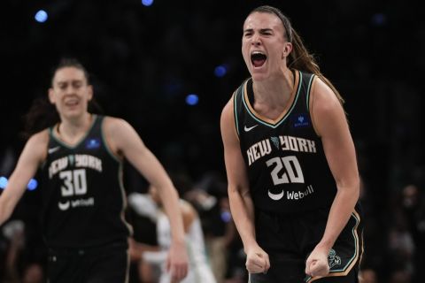 New York Liberty guard Sabrina Ionescu (20) reacts after scoring against the Minnesota Lynx during the third quarter of Game 5 of the WNBA basketball final series, Sunday, Oct. 20, 2024, in New York. (AP Photo/Pamela Smith)