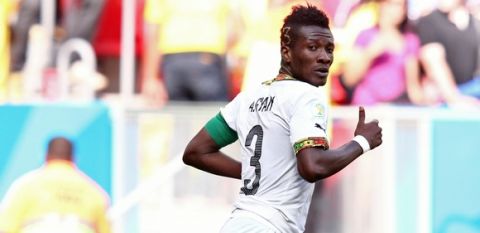 BRASILIA, BRAZIL - JUNE 26:  Asamoah Gyan of Ghana scores his team's first goal during the 2014 FIFA World Cup Brazil Group G match between Portugal and Ghana at Estadio Nacional on June 26, 2014 in Brasilia, Brazil.  (Photo by Adam Pretty/Getty Images)