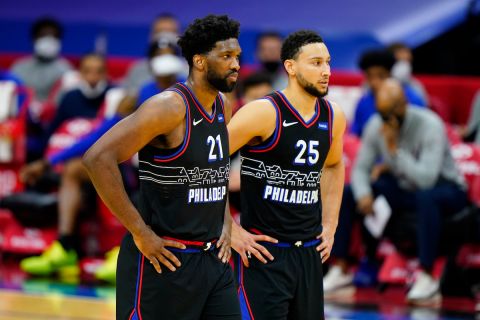 Philadelphia 76ers' Joel Embiid and Ben Simmons talk during an NBA basketball game against the Brooklyn Nets, Saturday, Feb. 6, 2021, in Philadelphia. (AP Photo/Matt Slocum)