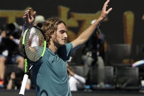 Greece's Stefanos Tsitsipas celebrates after defeating Spain's Roberto Bautista Agut in their quarterfinal match at the Australian Open tennis championships in Melbourne, Australia, Tuesday, Jan. 22, 2019. (AP Photo/Mark Schiefelbein)