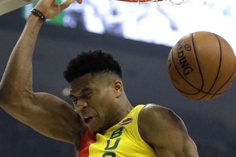 Milwaukee Bucks' Giannis Antetokounmpo dunks during the first half of an NBA basketball game against the Utah Jazz, Monday, Jan. 7, 2019, in Milwaukee. (AP Photo/Aaron Gash)