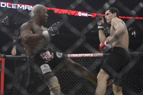 Roger Gracie, right, fights Kevin "The Monster" Randleman in a Strikeforce mixed martial arts match Saturday, May 15, 2010, in St. Louis. (AP Photo/Jeff Roberson) 