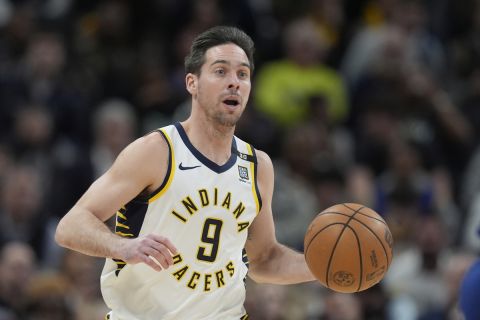 Indiana Pacers' T.J. McConnell dribbles during the first half of an NBA basketball game against the Golden State Warriors, Thursday, Feb. 8, 2024, in Indianapolis, (AP Photo/Darron Cummings)