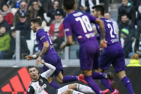 Juventus' Cristiano Ronaldo falls to the ground during a Serie A soccer match between Juventus and Fiorentina, in Turin, Italy, Sunday, Feb. 2, 2020. (Fabio Ferrari/LaPresse via AP)