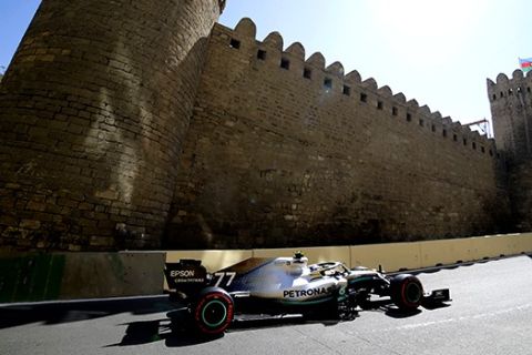 Mercedes driver Valtteri Bottas of Finland steers his car during the third free practice at the Baku Formula One city circuit in Baku, Azerbaijan, Saturday, April 27, 2019. The Azerbaijan F1 Grand Prix race will be held on Sunday. (AP Photo/Sergei Grits)