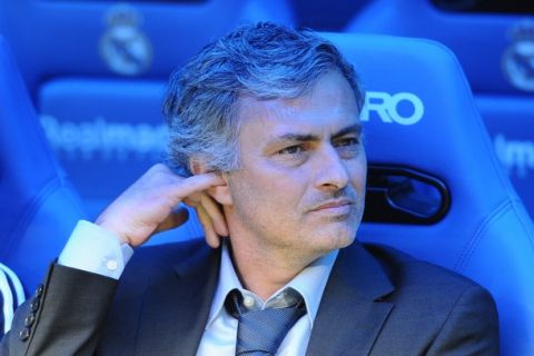 Real Madrid's Portuguese coach Jose Mourinho scratches his ear while looking on before the Spanish league football match between Real Madrid and Zaragoza at the Santiago Bernabeu stadium in Madrid, on April 30, 2011.  AFP PHOTO/DOMINIQUE FAGET. (Photo credit should read DOMINIQUE FAGET/AFP/Getty Images)