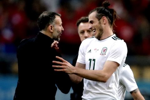 Wales' coach Ryan Giggs, left celebrates with player Gareth Bale during the match against China at the 2018 China Cup International Football Championship in Nanning in China's Guangxi province on Thursday, March 22, 2018. Wales defeated China in 6-0(Color China Photo via AP) CHINA OUT