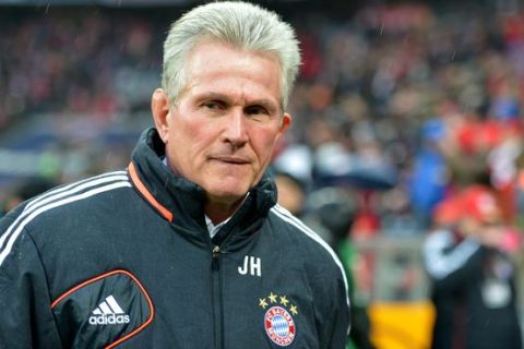 Bayern head coach Jupp Heynckes looks on prior the German first division Bundesliga soccer match between FC Bayern Munich and Hamburger SV  in Munich, Germany, Saturday, March 30, 2013. (AP Photo/Kerstin Joensson)