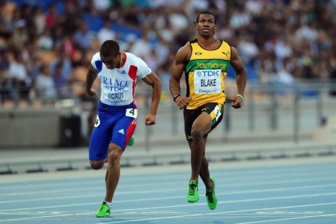 DAEGU, SOUTH KOREA - AUGUST 28:  Yohan Blake (R) of Jamaica and Jimmy Vicaut of France cross the finish line during the men's 100 metres semi finals during day two of the 13th IAAF World Athletics Championships at the Daegu Stadium on August 28, 2011 in Daegu, South Korea.  (Photo by Stu Forster/Getty Images)