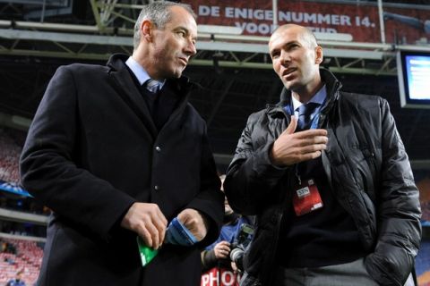 France's former footballer Zinedine Zidane (R) speaks with French Paul Le Guen during  the UEFA Champions League group G football match Ajax Amsterdam against Real Madrid on November 23, 2010, in Amsterdam. AFP PHOTO JOHN THYS (Photo credit should read JOHN THYS/AFP/Getty Images)