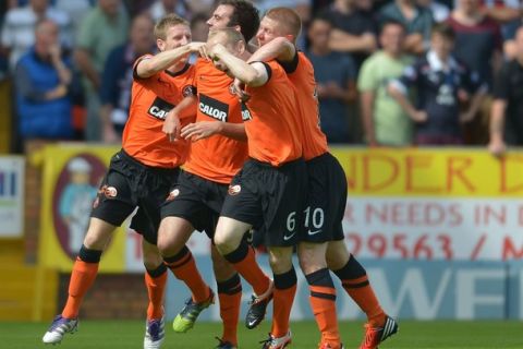 DUNDEE, SCOTLAND - AUGUST 19:  Kevin Gunning of Dundee United celebrates his goal during the SPL match from Tannadice Park Dundee on August 19, 2012 in Dundee, Scotland.  (Photo by Mark Runnacles/Getty Images)