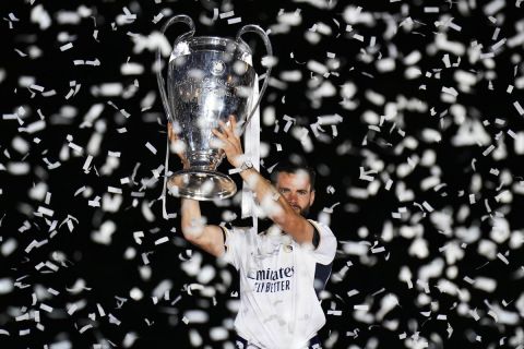 Real Madrid's Nacho holds the Champions League trophy at the Cibeles square during a trophy parade in front of the City Hall in Madrid, Spain, Sunday, June 2, 2024. Real Madrid won against Borussia Dortmund 2-0. (AP Photo/Bernat Armangue)