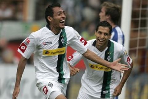 RESTRICTIONS / EMBARGO - ONLINE CLIENTS MAY USE UP TO SIX IMAGES DURING EACH MATCH WITHOUT THE AUTHORISATION OF THE DFL. NO MOBILE USE DURING THE MATCH AND FOR A FURTHER TWO HOURS AFTERWARDS IS PERMITTED WITHOUT THE AUTHORISATION OF THE DFL.
Borussia Moenchengladbach's Venezuelan midfielder Juan Fernando Arango (L) celebrates scoring with his French teammate striker Karim Matmour during the German first division Bundesliga's football match VfL Bochum vs Borussia Moenchengladbach in the western German city of Bochum on August 9, 2009.  AFP PHOTO DDP / JUERGEN SCHWARZ GERMANY OUT (Photo credit should read JUERGEN SCHWARZ/AFP/Getty Images)