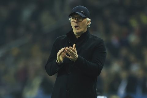 Lyon's head coach Laurent Blanc gestures during the French League One soccer match between Paris Saint-Germain and Lyon at the Parc des Princes stadium in Paris, Sunday, April 2, 2023. (AP Photo/Aurelien Morissard)