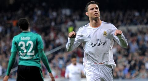 MADRID, SPAIN - MARCH 18:  Cristiano Ronaldo of Real Madrid celebrates after scoring his team's second goal during the UEFA Champions League Round of 16, second leg match between Real Madrid and FC Schalke 04 at Estadio Santiago Bernabeu on March 18, 2014 in Madrid, Spain.  (Photo by Denis Doyle/Getty Images)